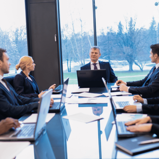 Businesspeople sitting around conference table